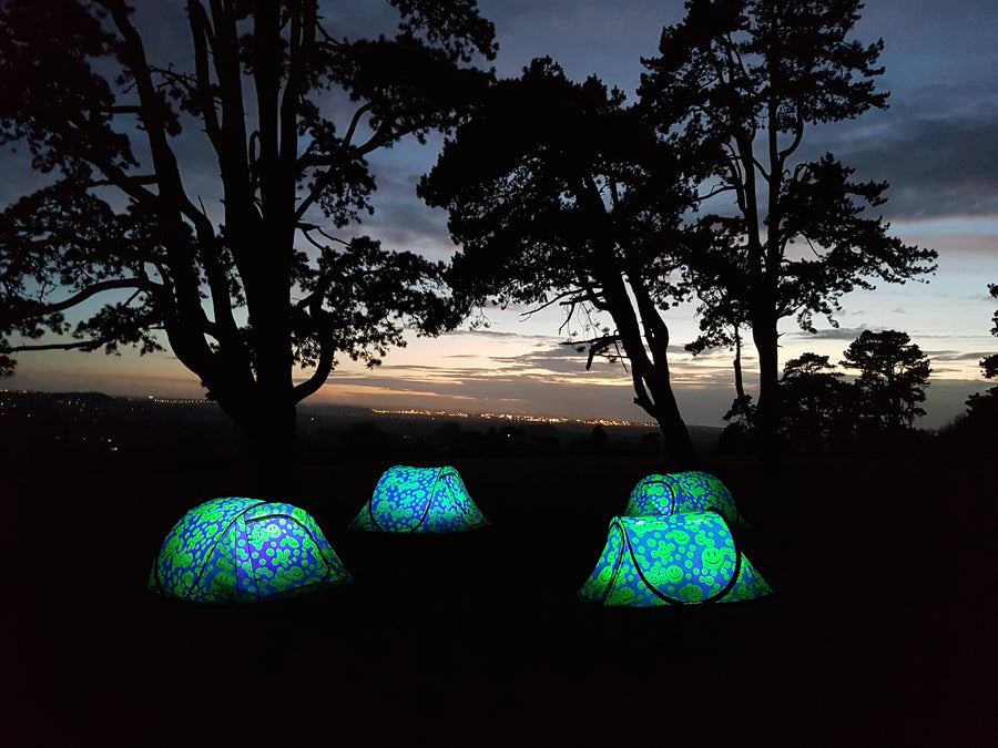 Emoji Gorilla Festival Tents Glowing in the dark at Night